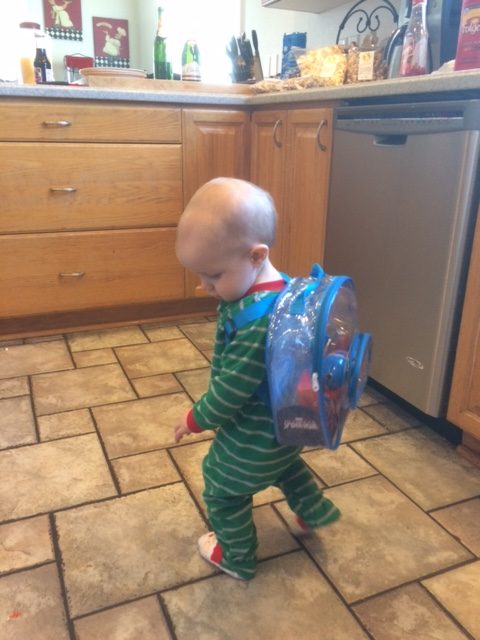 Loves his new fishing pole backpack