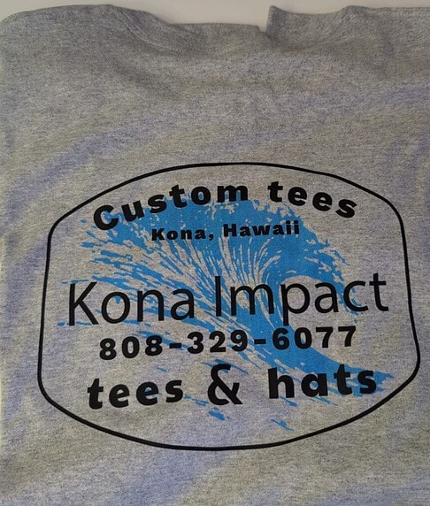Custom Hawaii T-shirt with Kona Impact logo and splash design for island apparel.