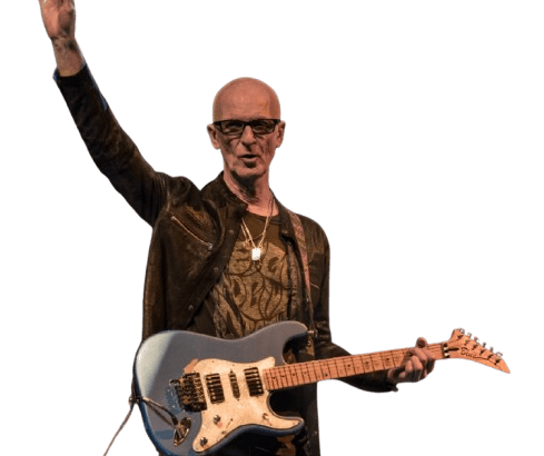 Kim Mitchell waving to audience
Live Performance: Kim Mitchell