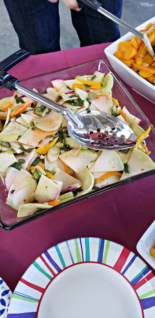 Sliced kohlrabi salad with spoon