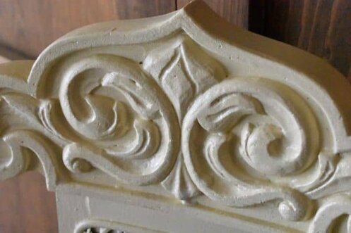 Painted chair back, floral detail.