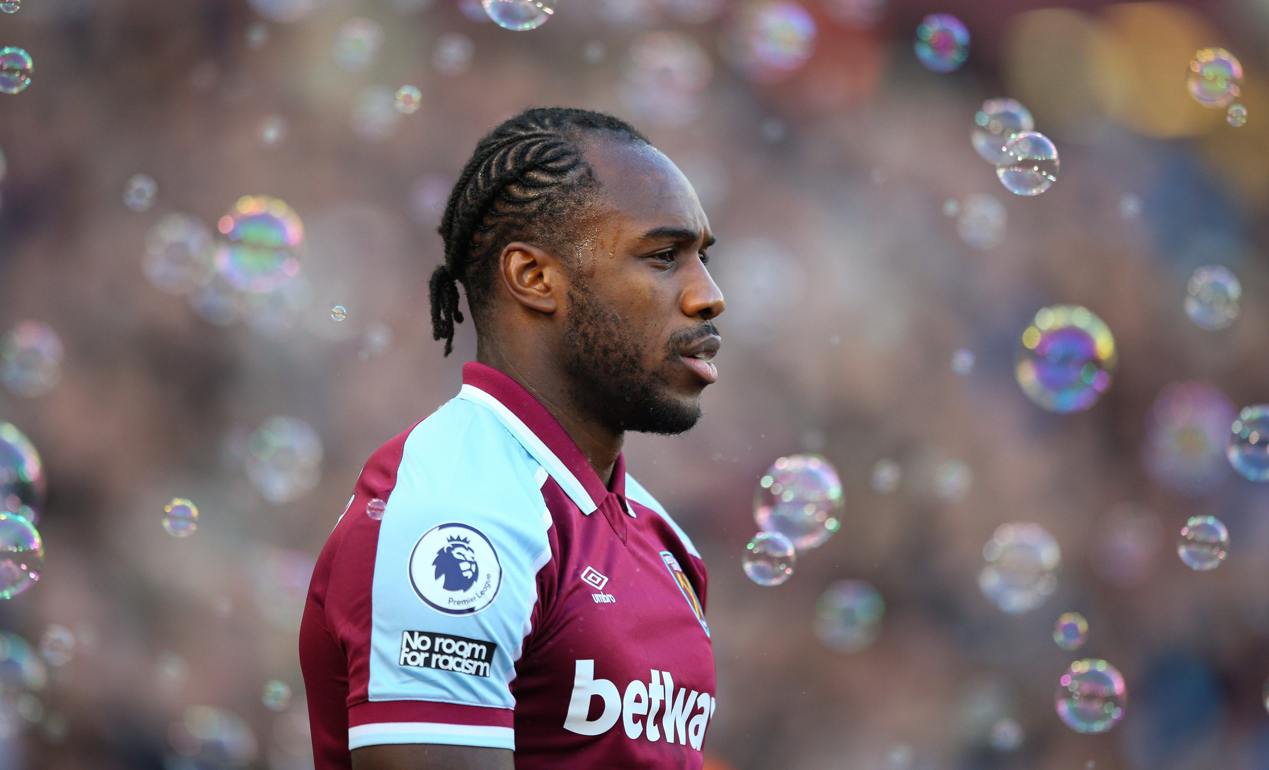 West Ham footballer Michail Antonio looking onto the pitch before a Premier League match against Leeds United at London Stadium