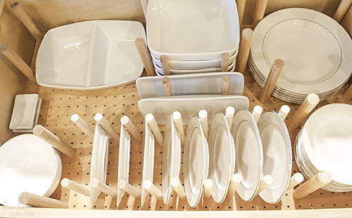 overhead view of custom peg drawer for dishes