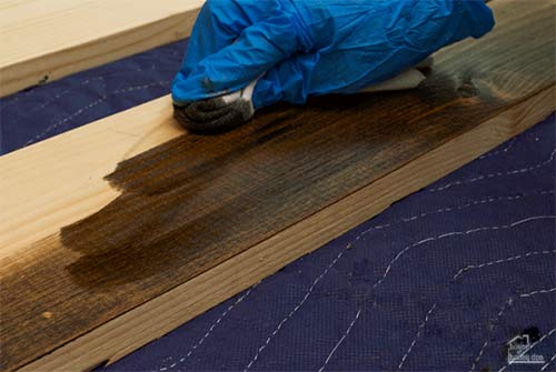 applying stain to wood