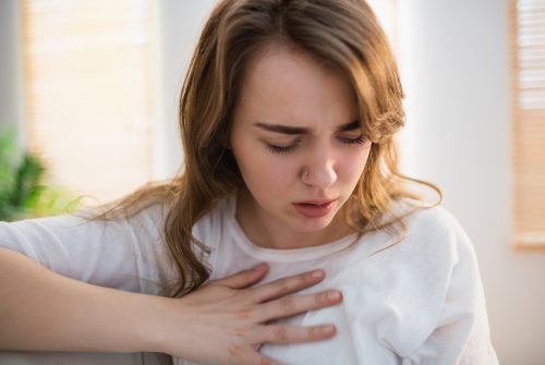 Pretty woman suffering from chest pain 646880