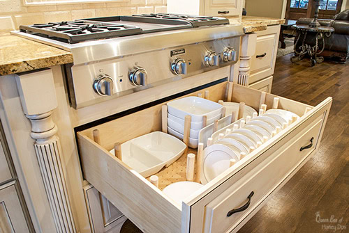 peg dish organizer in a drawer with dishes