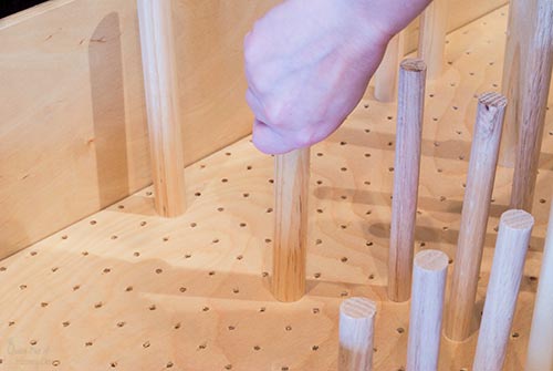 adding dowel pegs to dish drawer organizer