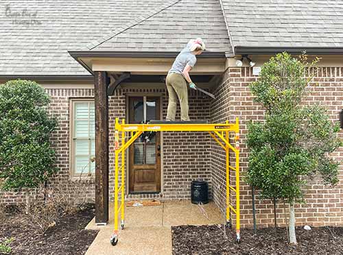 Queen Bee of Honey Dos installing gutter guards