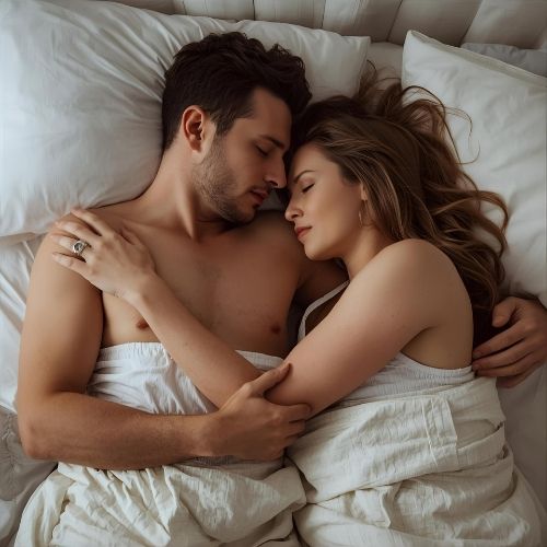 man and woman in bed after intimacy,