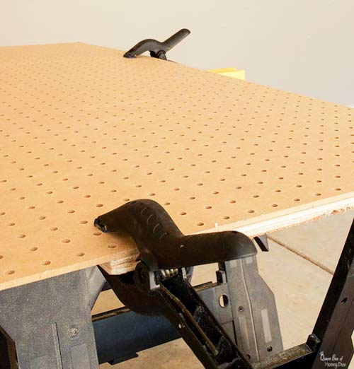 pegboard clamped to plywood