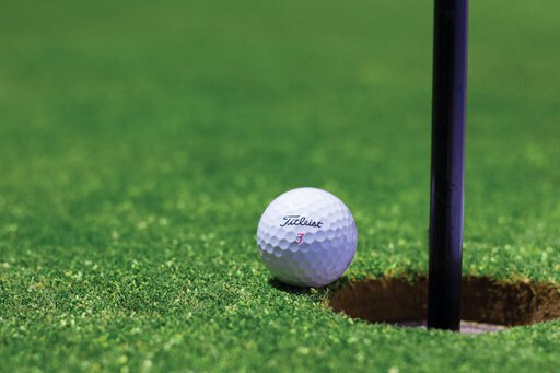 From Dating to Networking: Why Professionals are Flocking to Tinder's New Feature 8 titrist golf ball near golf hole