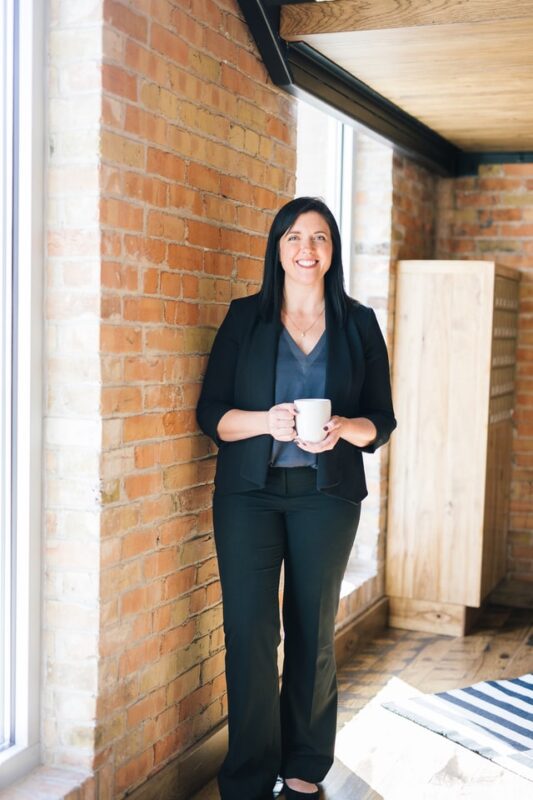 businesswoman standing - tall image
