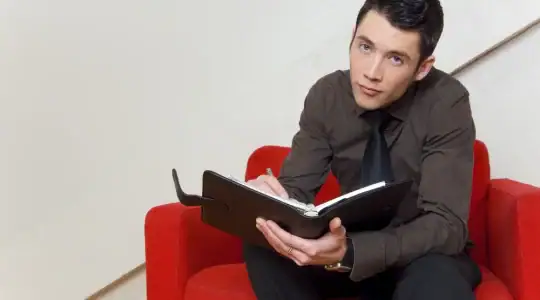 A young adult using a planner to create a routine to help with executive functioning