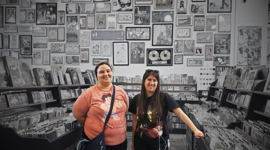 Two roommates at a record store