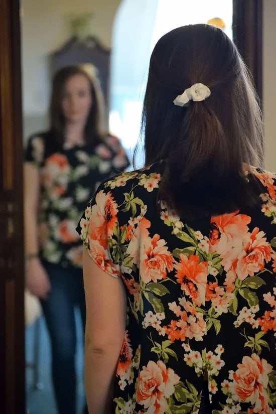 mirror technique woman looking at self in full length mirror
