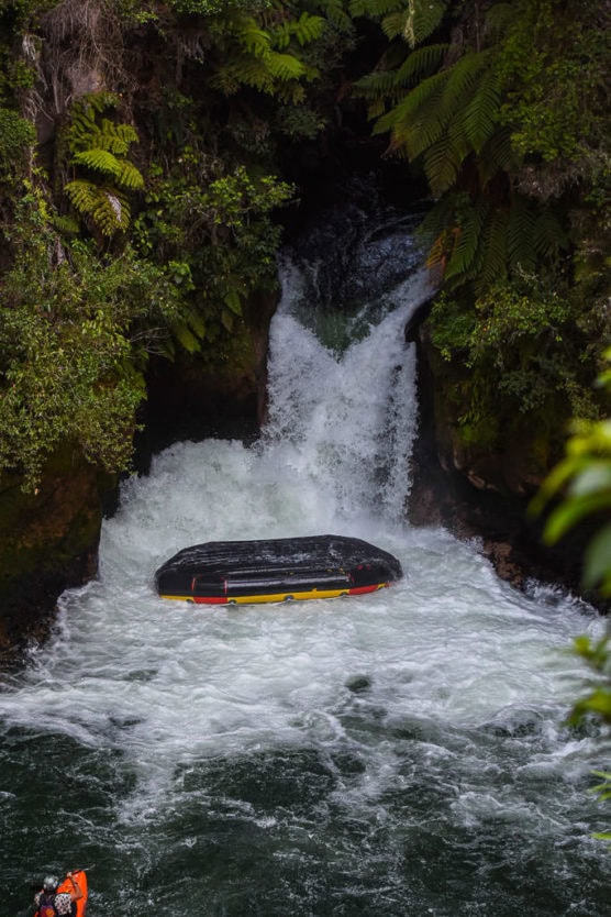 flipping over tutea falls on new zealand rafting trip with kaituna cascades