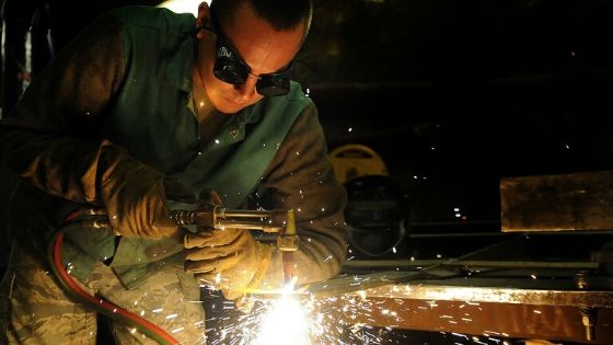 Welder working metal traps