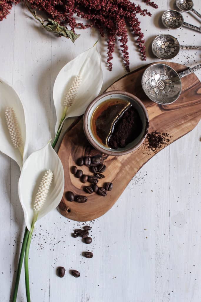 2-ingredient herbal honey and coffee grounds face mask in a small bowl