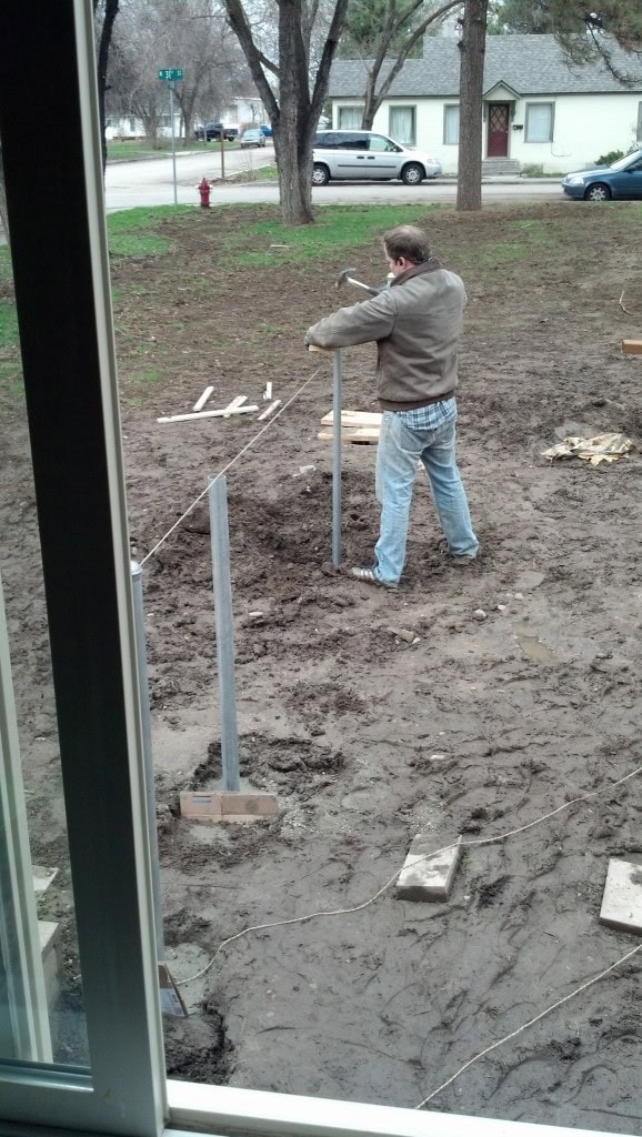 James out there working hard to make D a fence, it was a sopping wet weekend, He was able to get all the concrete in before it really started coming down but it was not the best weekend for fence building, he did what he needed to though to get it closer to enclosed for D though, and I appreciate it!