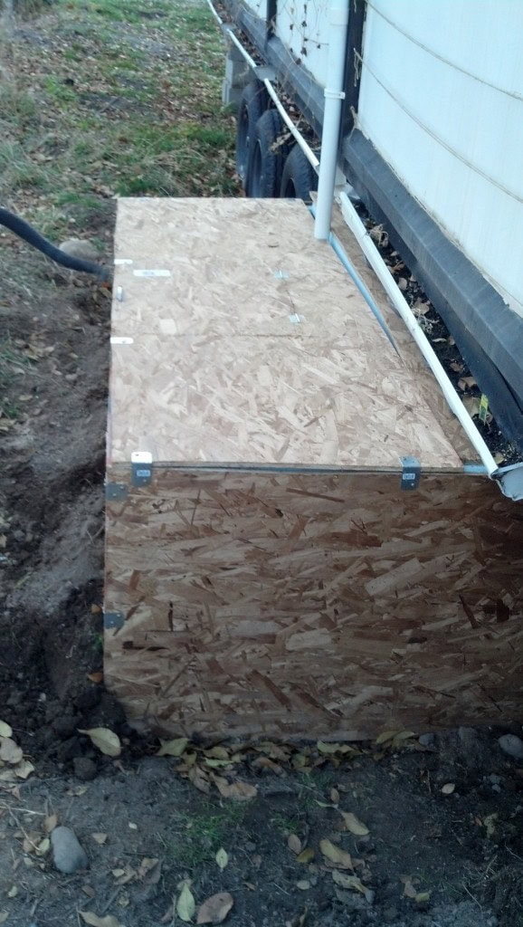 Back to work, I got, at most, exactly one half of an hour of light to work each day after work if I race home at 5pm.  Daylight savings time makes for long outside projects!  It worked though just took more days than it should have.  You ca barely see it but all the little spaces between got filled with batt insulation wrapped in plastic, should make a fairly sealed off space, even though it only has about an r-10 value to the insulation it ought to be able to do the job.  I hope, I'll monitor it.