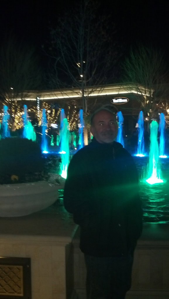 My brothers and I took a little trip to the new town center too, it is a pretty bumping place, the restaraunts all had 2.5-3 hour waits so we just tooled around and went to our favorite Thai place for dinner.  Here is Jeff in front of one of the best fountains in the country apperently, According to the developer the motor on this fountain is more powerful than the Bellagio.  They aare also in the process of putting in an outdoor ice skating rink, that will be pretty cool to check out :)