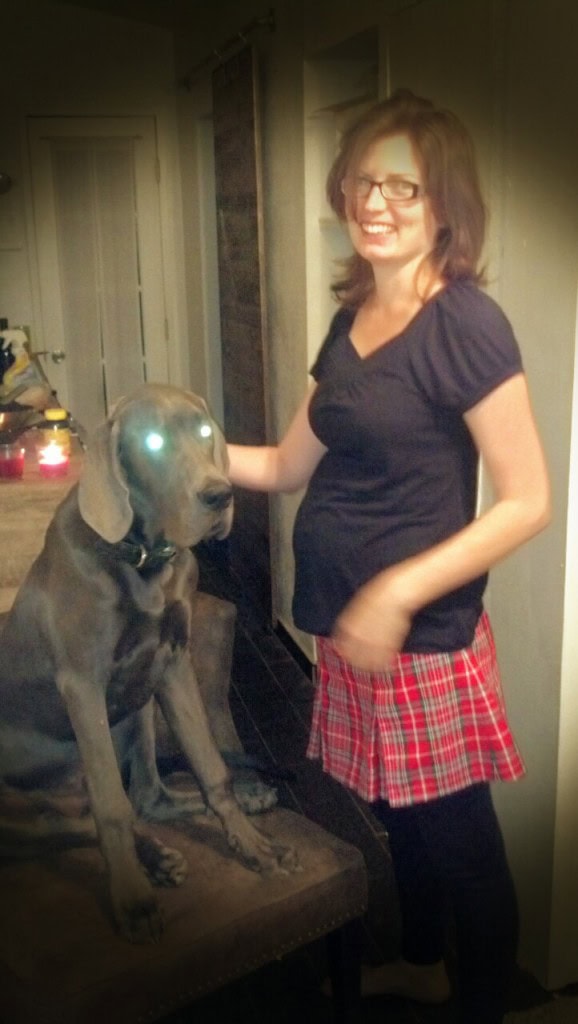 Some preggo pictures, this is 22 weeks, finally starting to have a consolation for feeling all sickly, MiniMiller is growing bigger! And Denver turned evil!