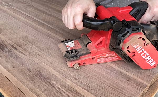 flattening wood with belt sander