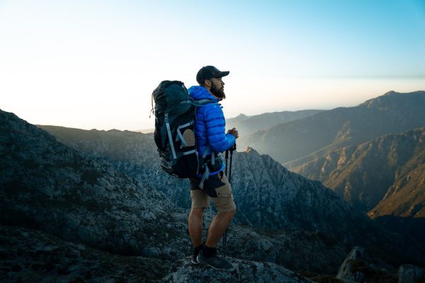 Person with a hiking backpack 600x400 - Home