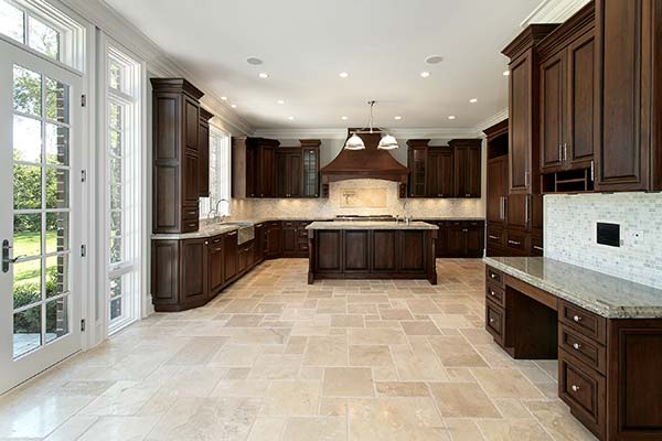 Kitchen with travertine tile in versailles pattern.