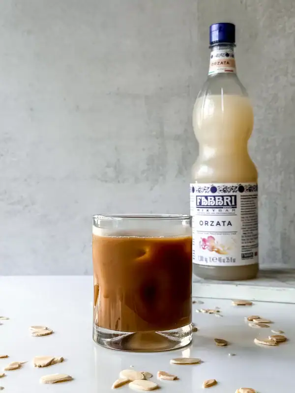 Iced coffee with Orgeat Syrup in a glass