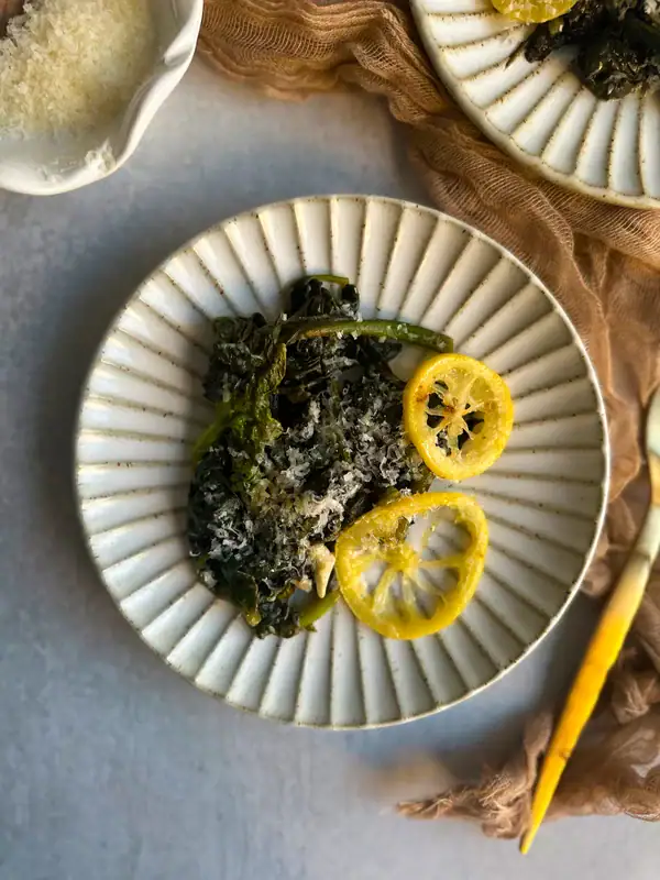 Spinach Sautéed plated on a white rimmed plate