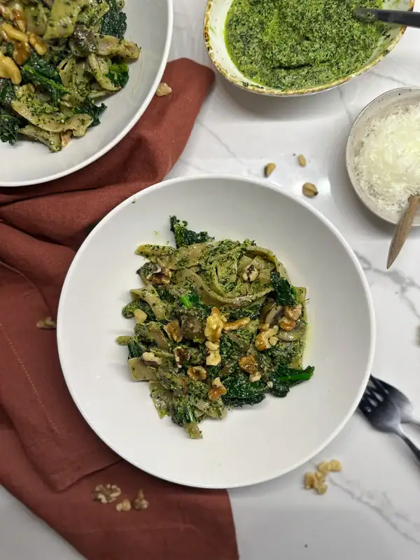Spelt Tagliatelle Pasta with Kale Walnut Pesto in plates
