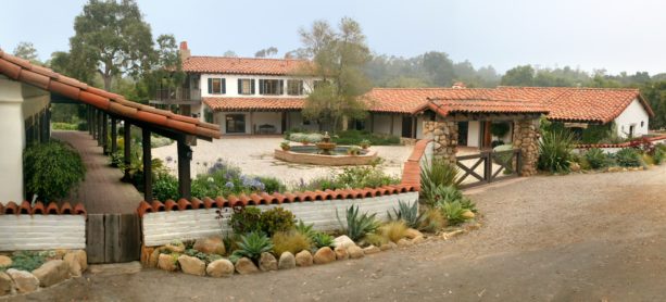 traditional spanish style home with a central courtyard surrounded by walled gardens