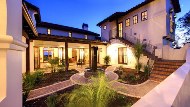 combination of hacienda spanish style and tuscan design home with stone courtyard