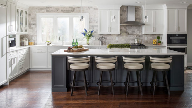 dark hickory forge ringing anvil floor and simple white cabinets in a large kitchen