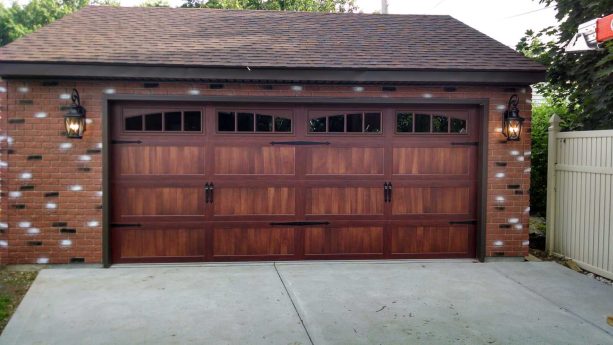 carriage door with long wood panels and arched glass