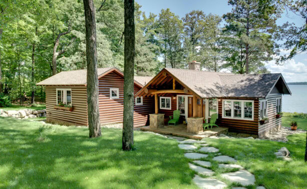 small log cabin porch completed with bright colored furniture