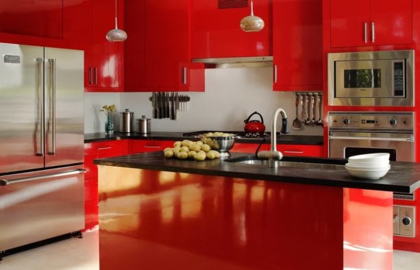 red and black kitchen design with stainless-steel appliances