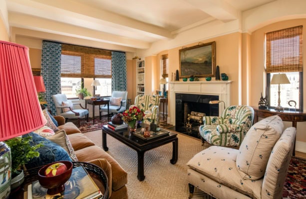 light orange wall and blue accent in the decoration of a formal living room