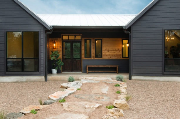 beautiful one-story ranch style cottage in a grey-colored vinyl siding