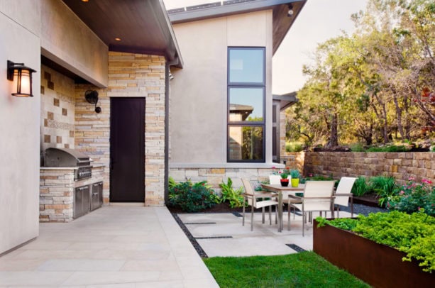 timeless concrete patio in a small backyard as a bbq area