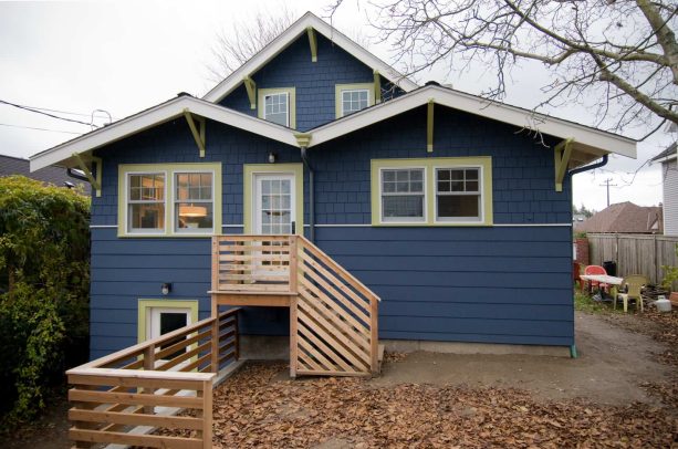 an unusual pair of simple window trim painted in pratt & lambert - split pea green and siding painted in daly’s - sorcerer blue