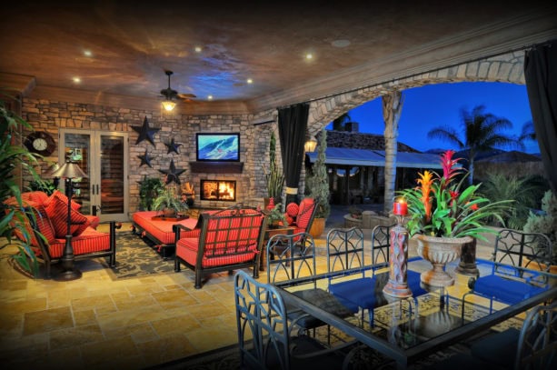 tuscan travertine covered patio with wood burning fireplace