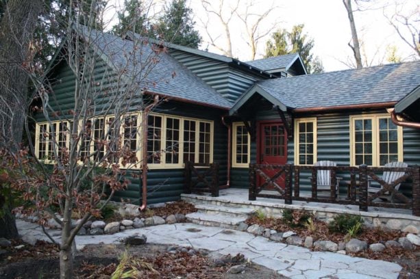 rustic wood exterior log cabin with custom color in benjamin moore paint