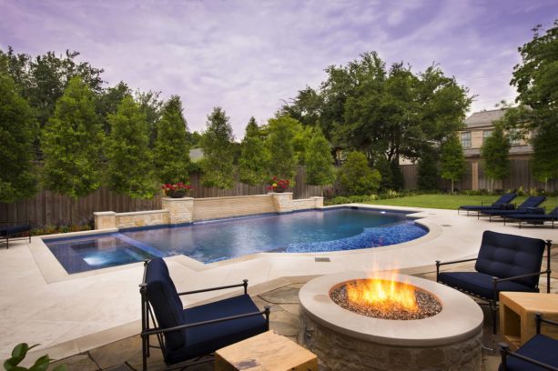 a tuscan stamped concrete and custom-designed pool