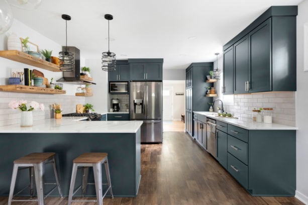 combination of blue gray kitchen cabinets with marble-like quartz countertops