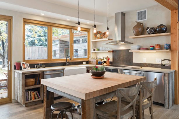 countertop folding windows over a farmhouse sink in a u-shaped kitchen