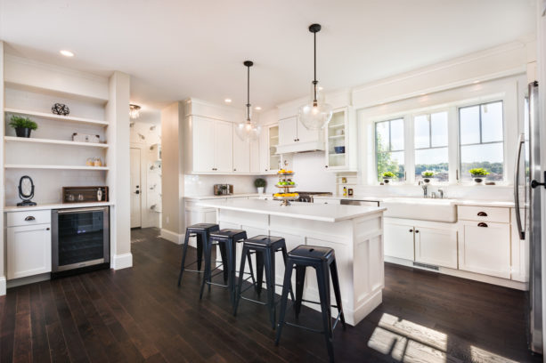 large single-hung windows with deep sill over a farmhouse sink in an open kitchen