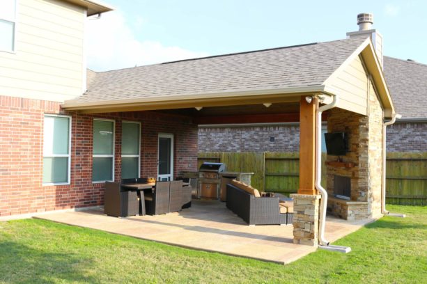 stamped concrete covered patio with gas burning fireplace