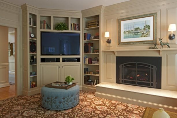 white wall unit with polished black fireplace